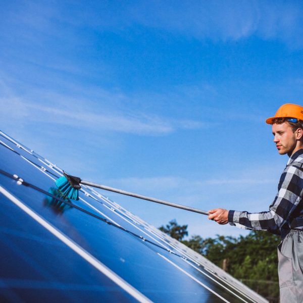 man-worker-firld-by-solar-panels